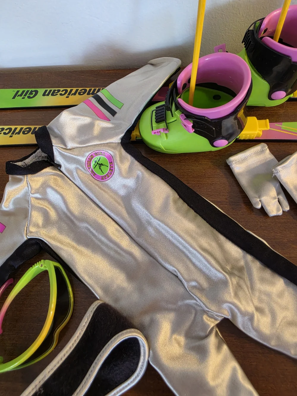 American Girl Silver Ski Suit with Neon Green and Pink Skis